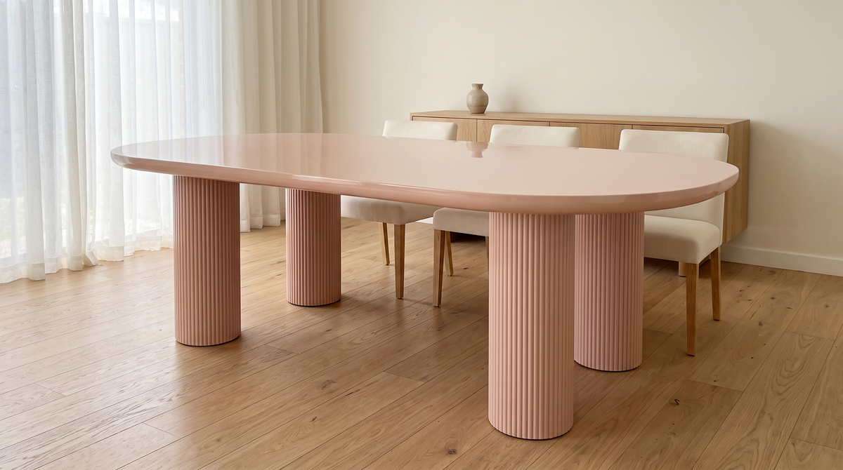 Oval dining table with chairs in a bright dining room