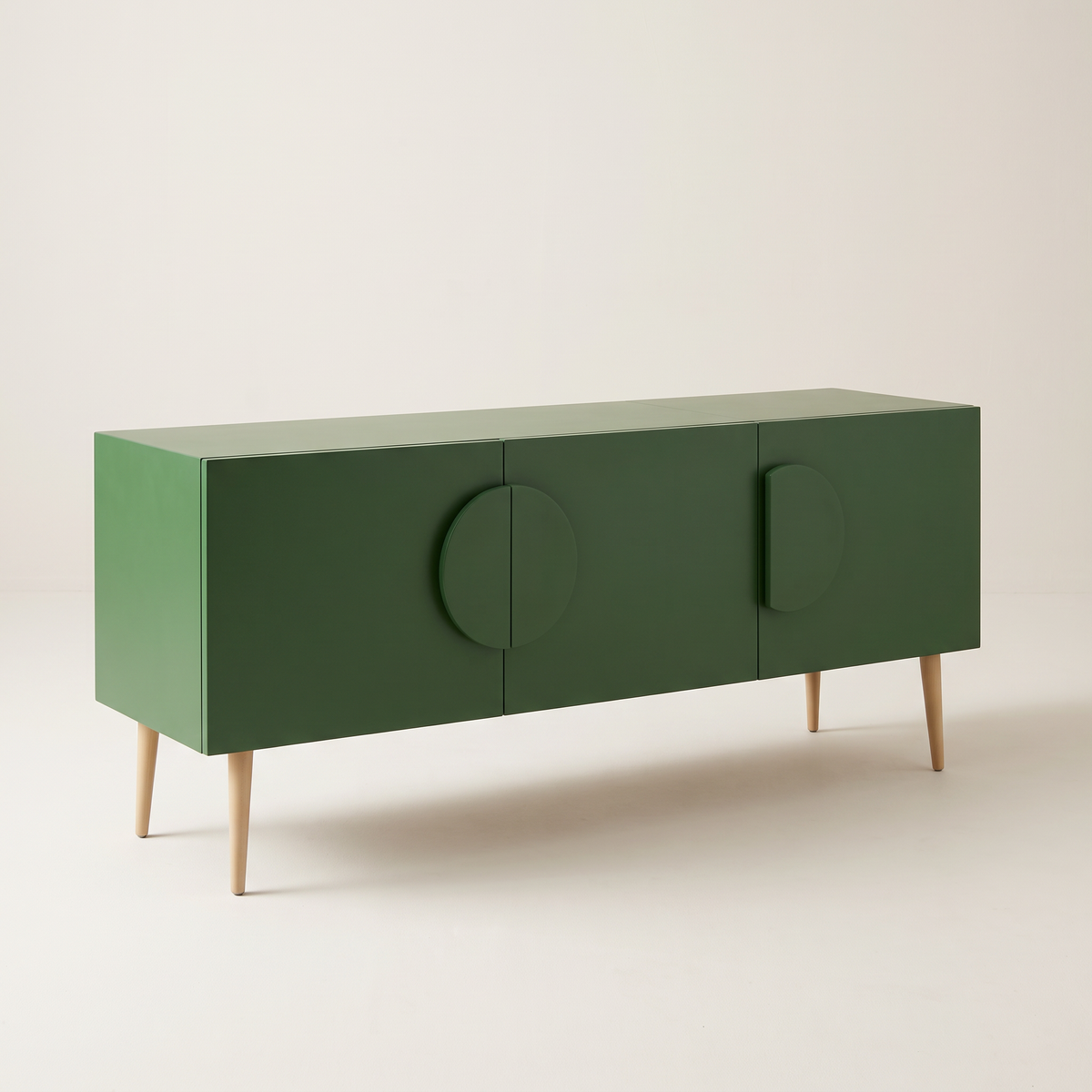 Alto Green storage cabinet in matte green with half-disc handles and tapered splayed legs, front three-quarter view