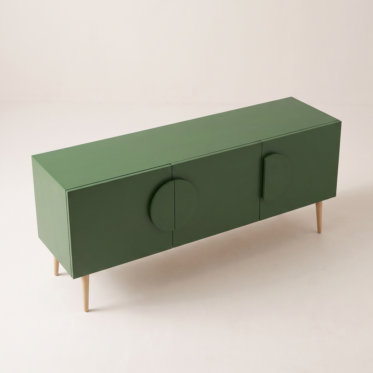 Alto Green storage cabinet in matte green with half-disc handles, elevated three-quarter view showing the top