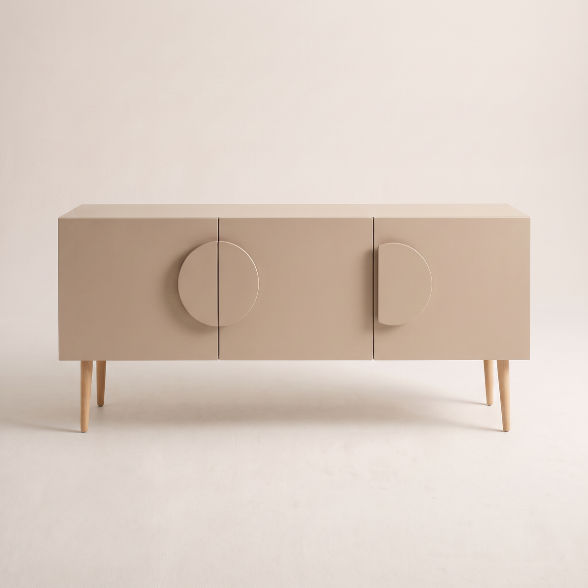 Alto Ivory storage cabinet in matte ivory-beige with half-disc handles and tapered wooden legs, front view