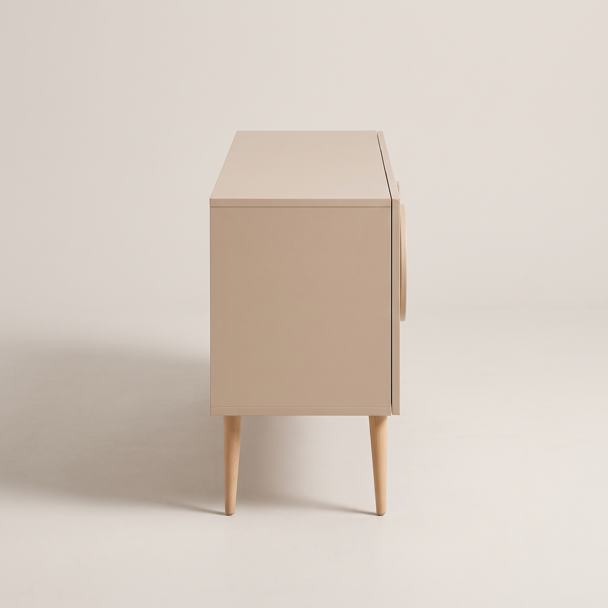 Alto Ivory storage cabinet in matte ivory-beige with tapered wooden legs, side profile view