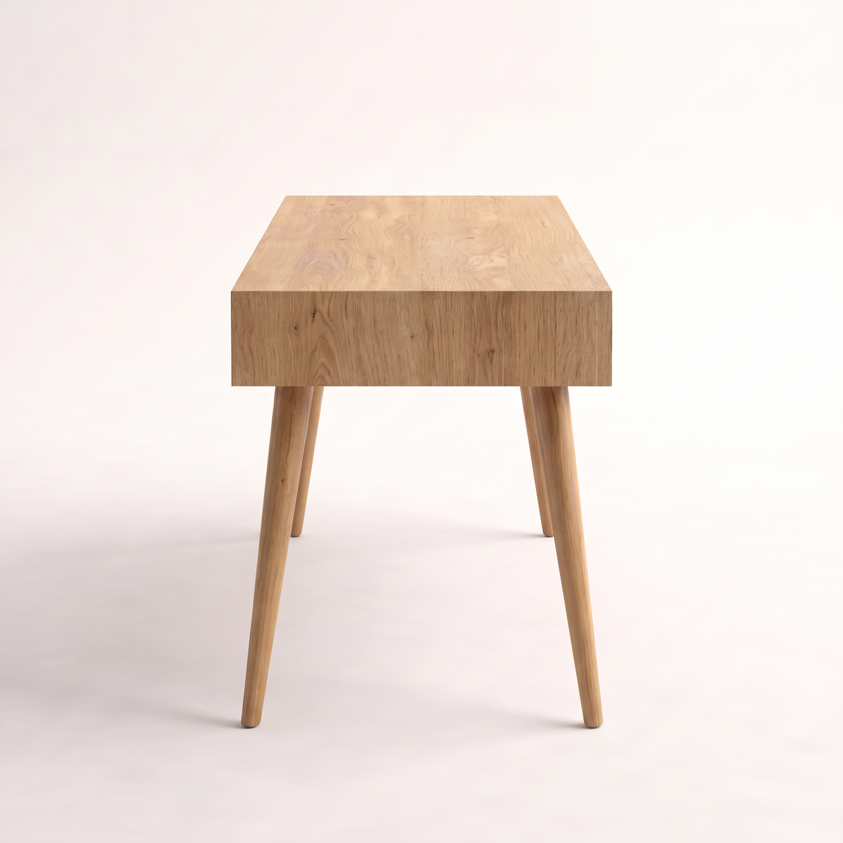 Arc Desk study desk in light wood veneer with splayed tapered legs, side profile view