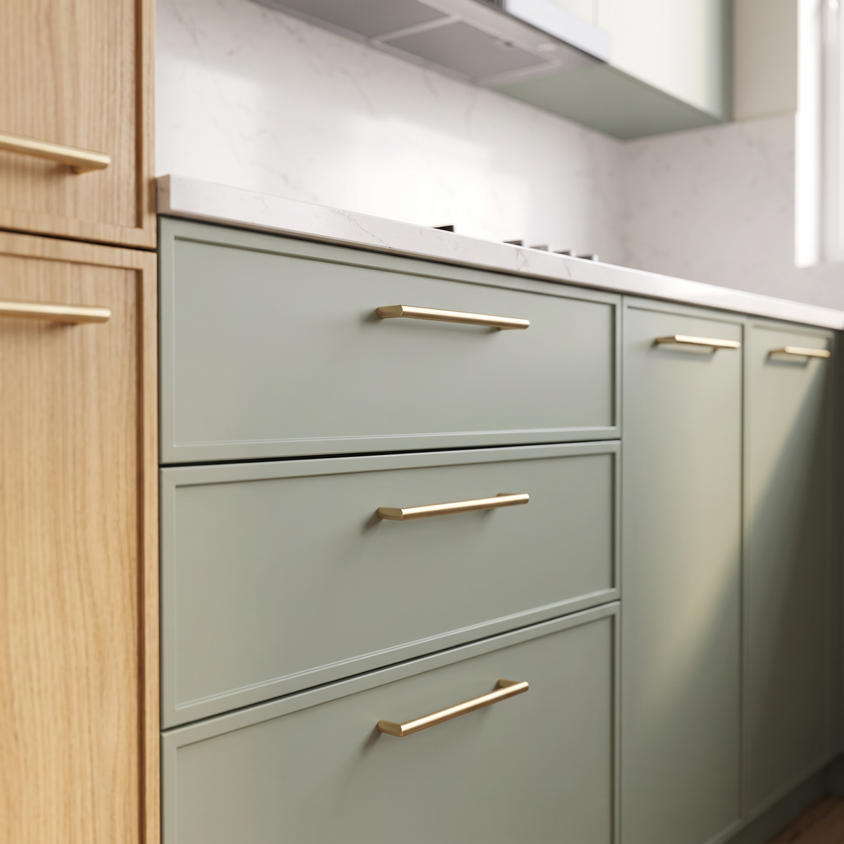 Arden L-Kitchen detail of sage matte drawer fronts with brushed brass bar pulls and quartz edge