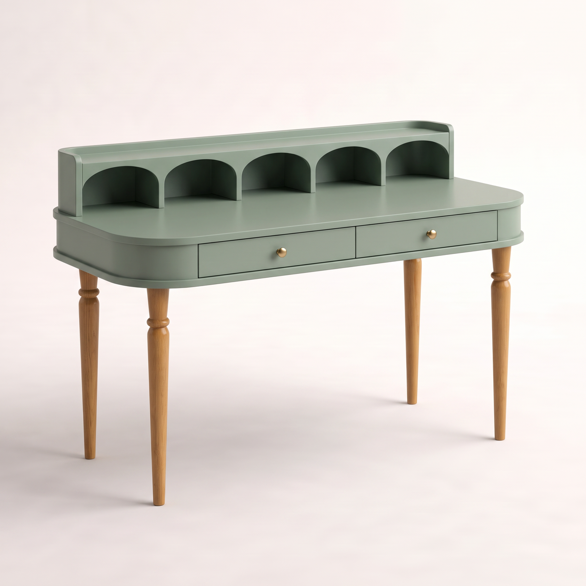 Atelier Sage writing desk in sage matte lacquer with arched gallery cubbies, two brass-knob drawers and turned ash legs, front three-quarter view