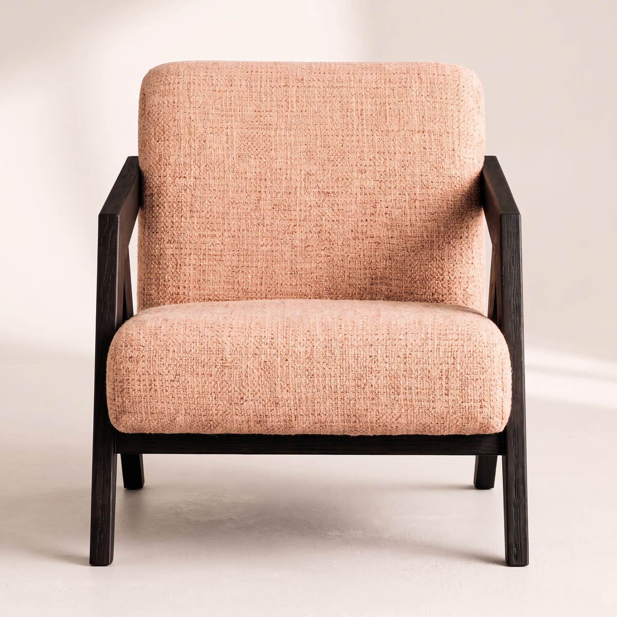 Axis Sand lounge chair in sand peach textured tweed with angular black wooden frame, front view