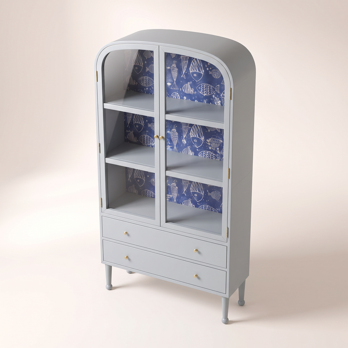 Azure Cove Cabinet in powder blue with glass doors and navy fish-print wallpaper, elevated three-quarter view showing the top