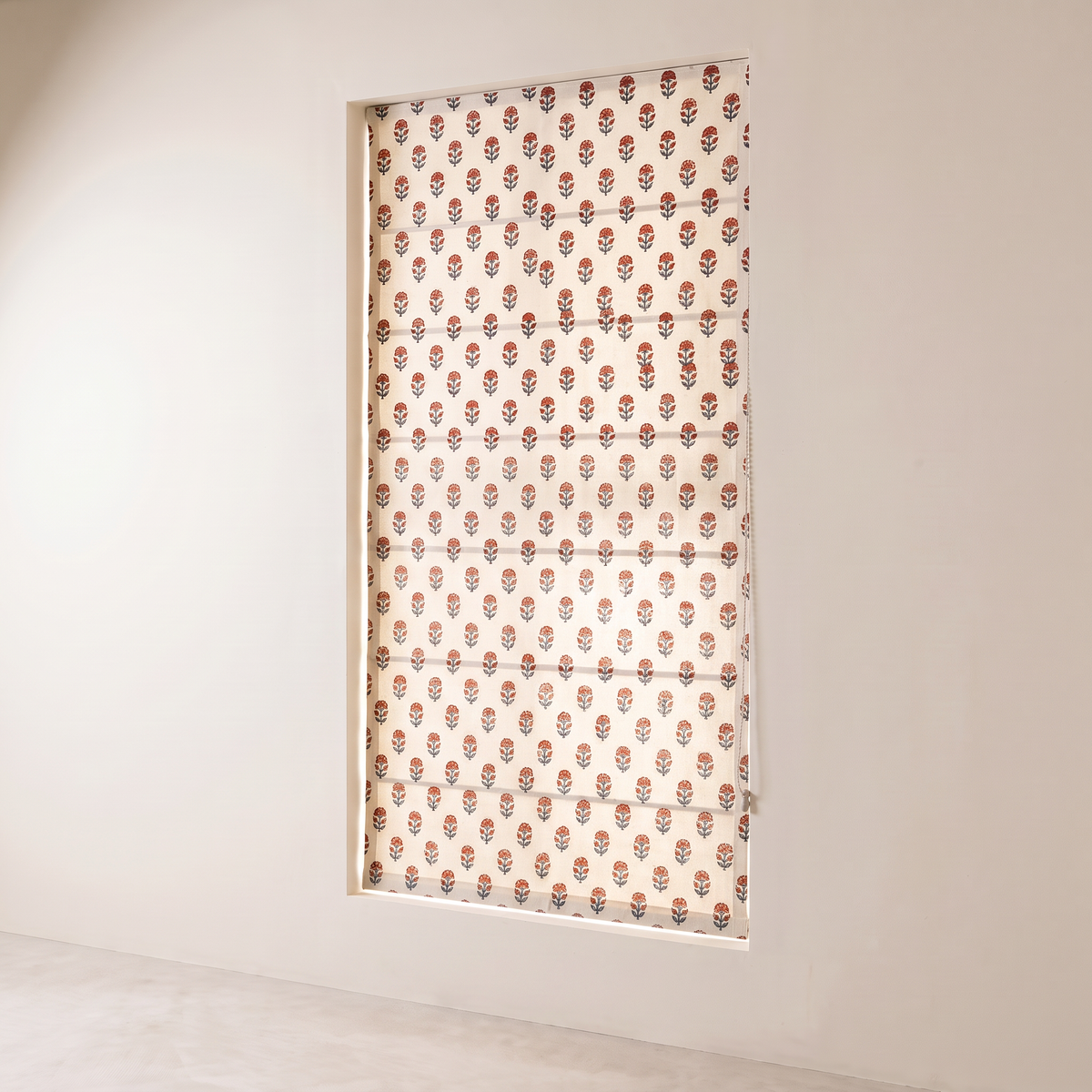 Bagh Roman Blind fully lowered, showing the rust and indigo floral block print on ivory cotton