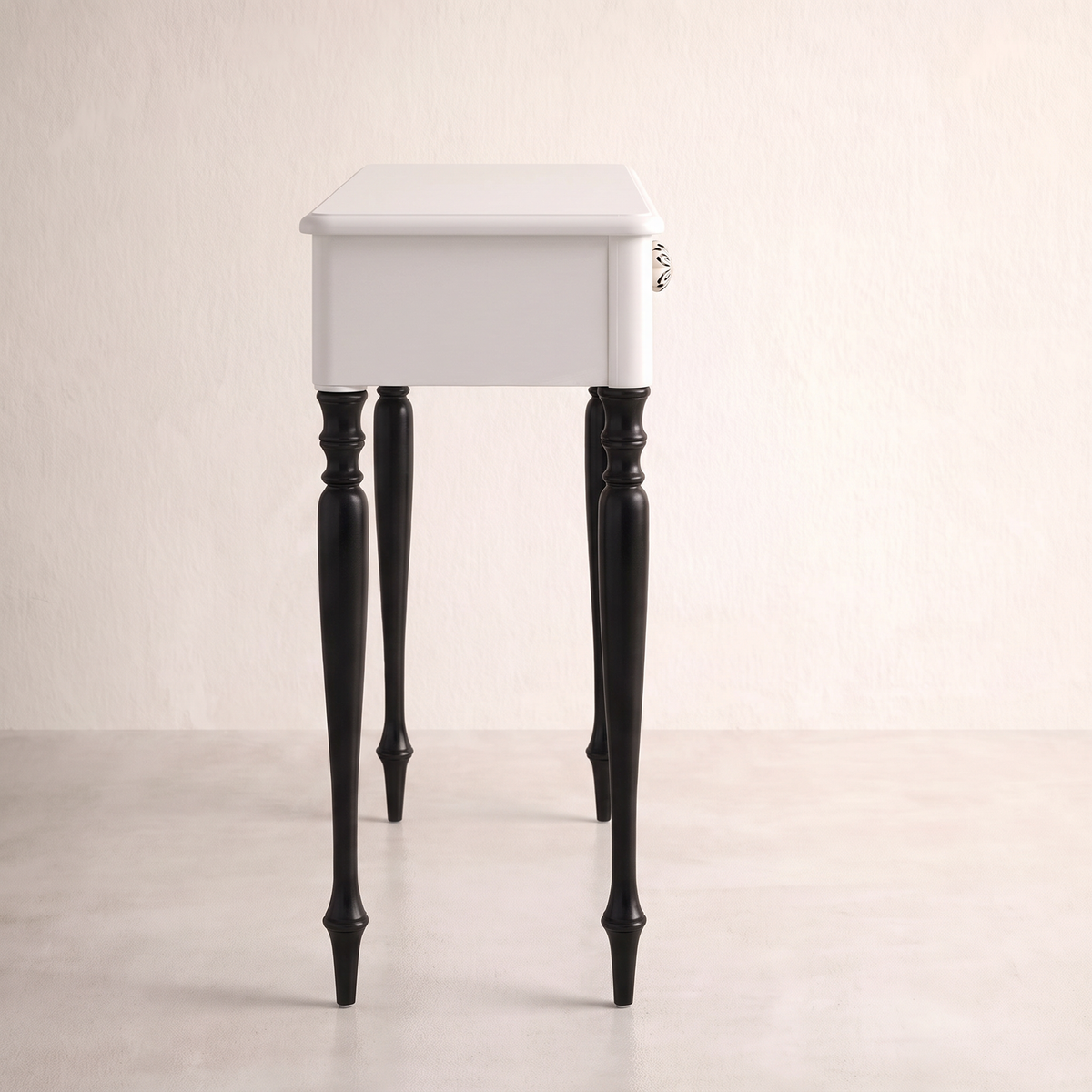 Belle console table in white with black turned legs, side profile view