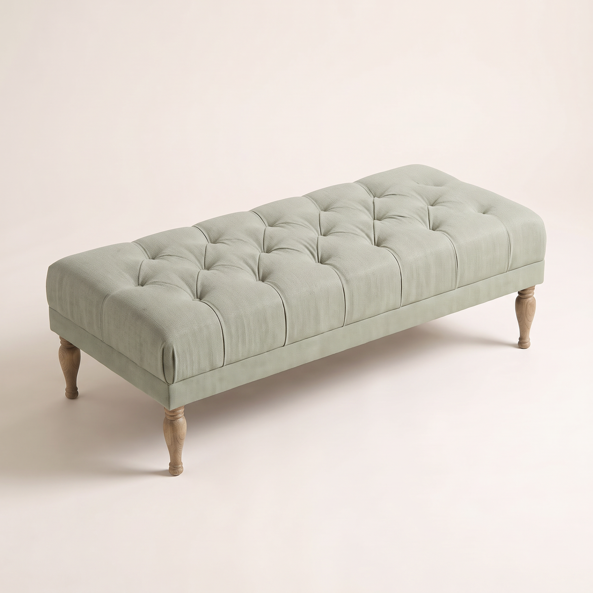 Belmont Sage ottoman bench, elevated three-quarter view showing the button-tufted top