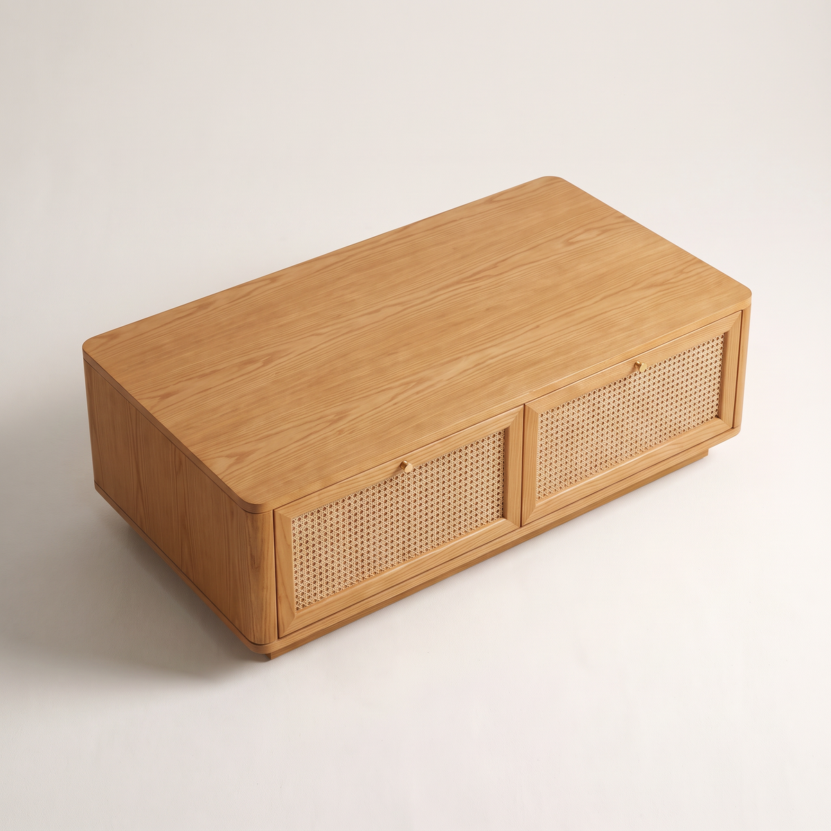 Bento Ash coffee table showing its straight-grain ash veneer top and cane drawers, elevated three-quarter view
