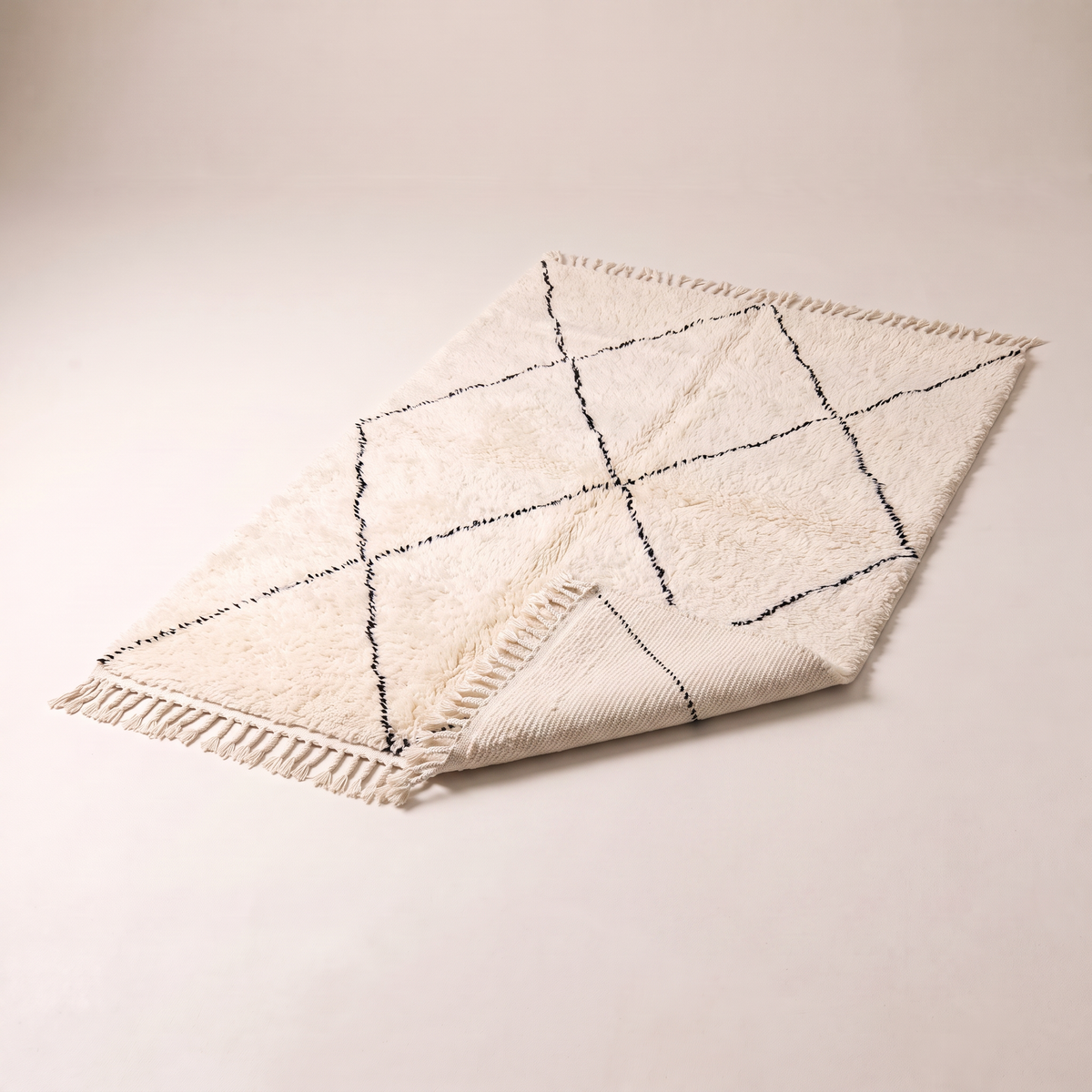 Berber Cloud Shag with a corner folded back to show the woven underside and thickness