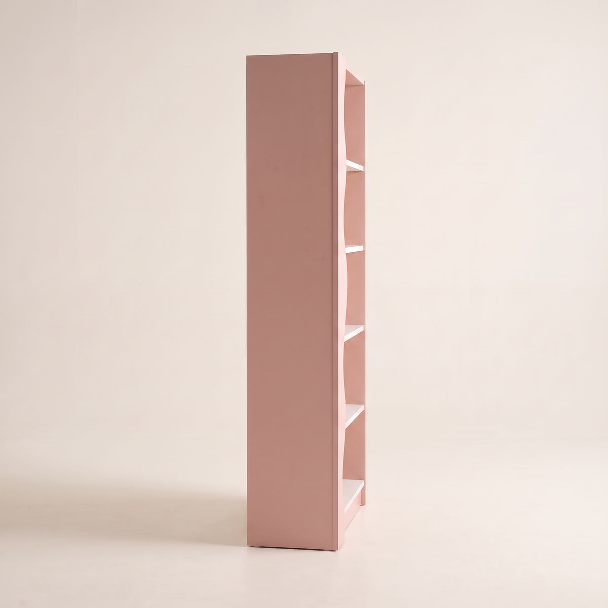 Blush Cane bookcase in blush pink, side profile view