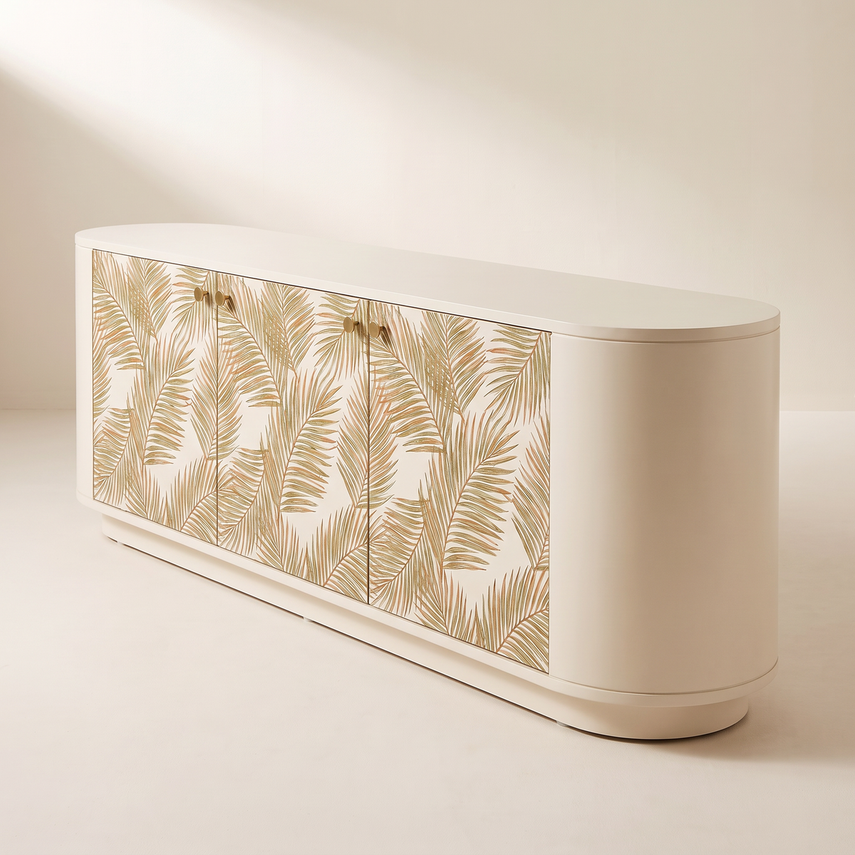 Botanica Console cream TV unit with palm-leaf doors and brass knobs, front-right three-quarter view