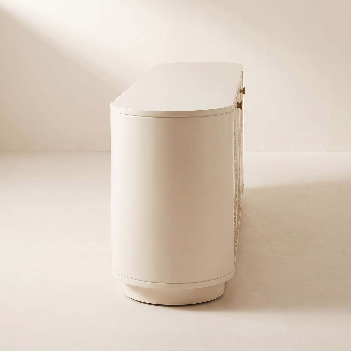 Botanica Console cream TV unit, rounded end and recessed plinth seen from the side