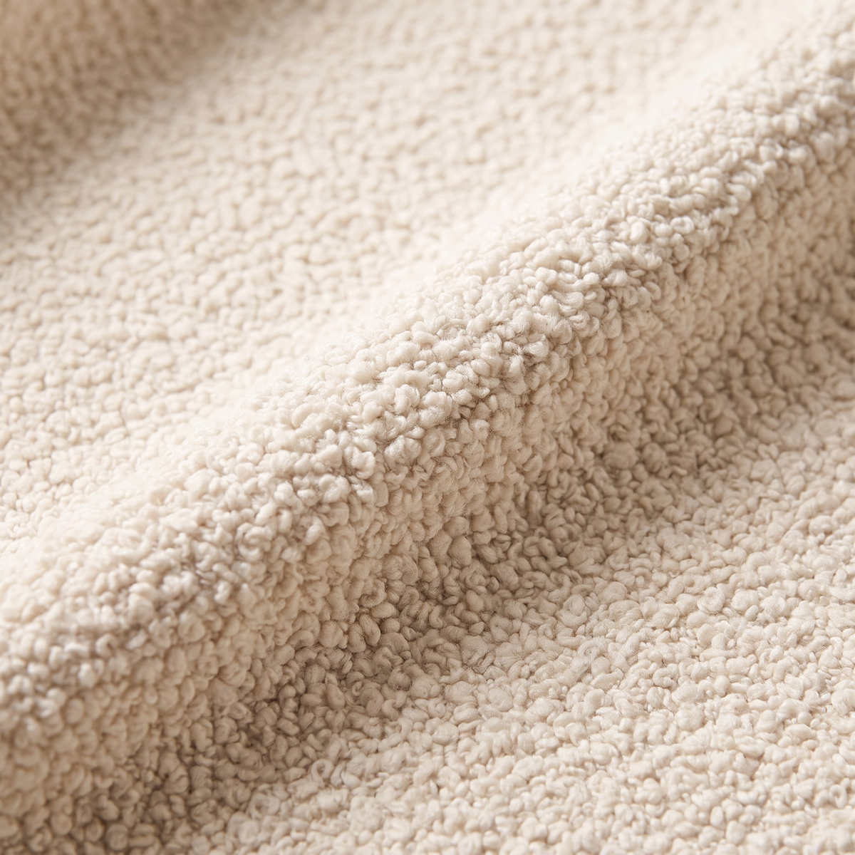 Bouclé Ivory upholstery fabric, macro close-up of the nubby ivory bouclé loops