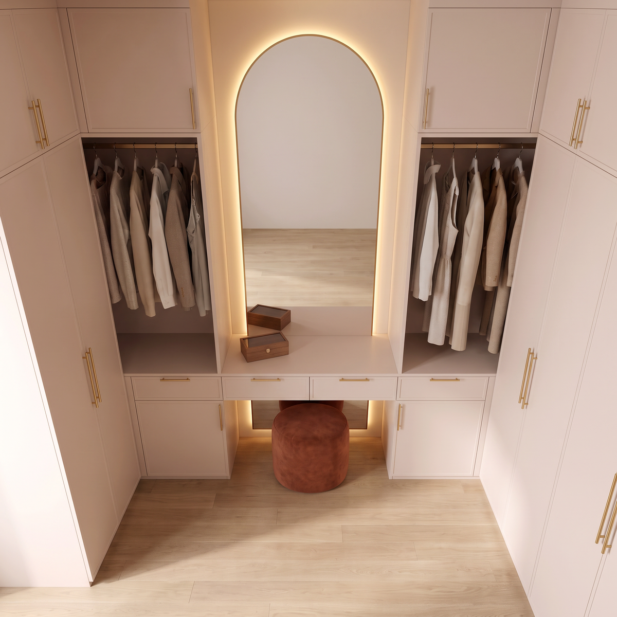 Boudoir Closet dressing nook with rust velvet pouf and blush-ivory cabinetry, elevated view