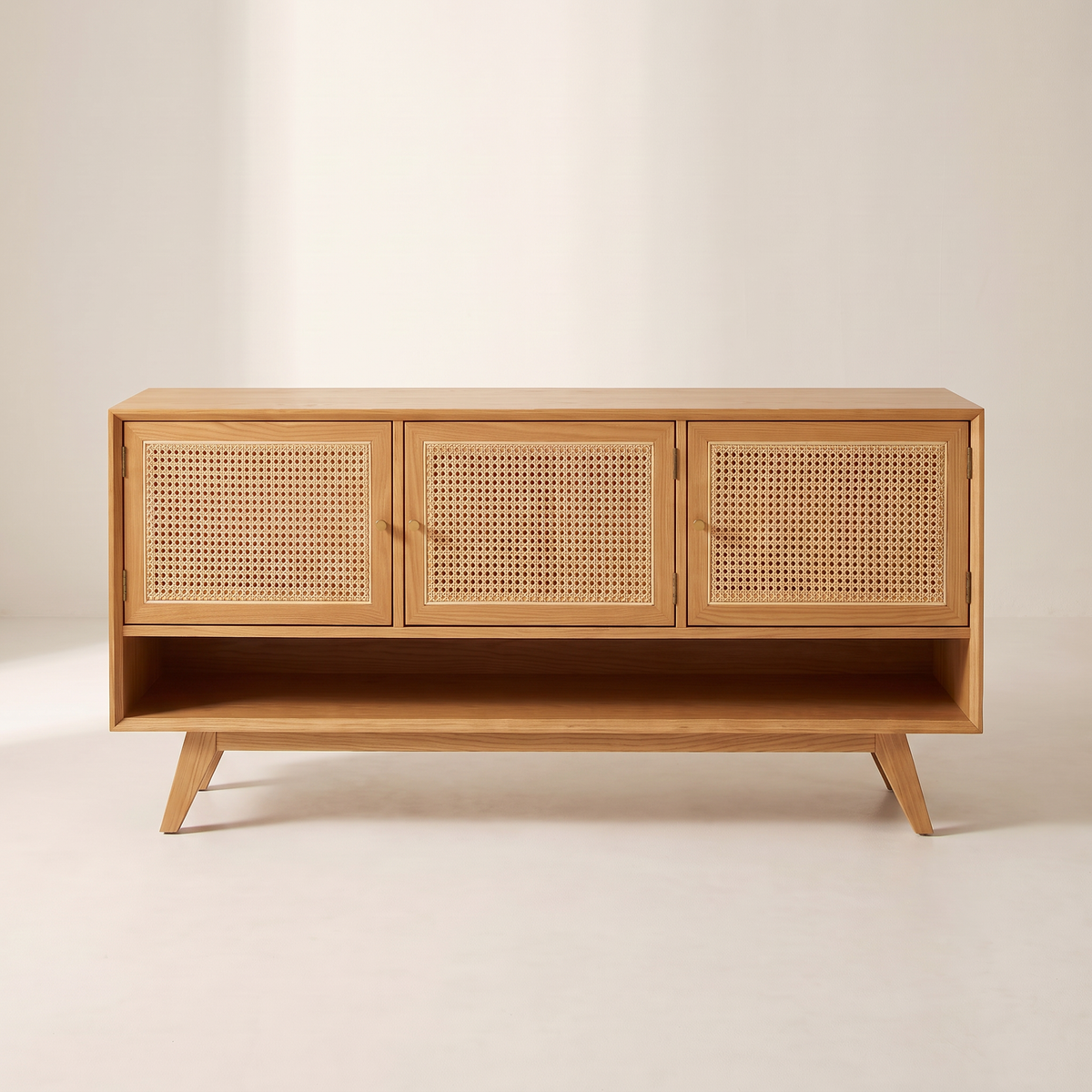 Cane Tempo honey ash TV unit with three cane-panelled doors, straight front view