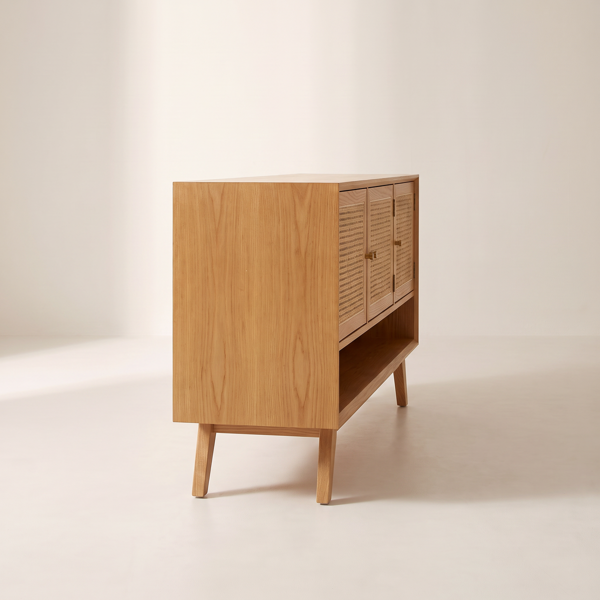 Cane Tempo honey ash TV unit, left side view showing depth and splayed legs