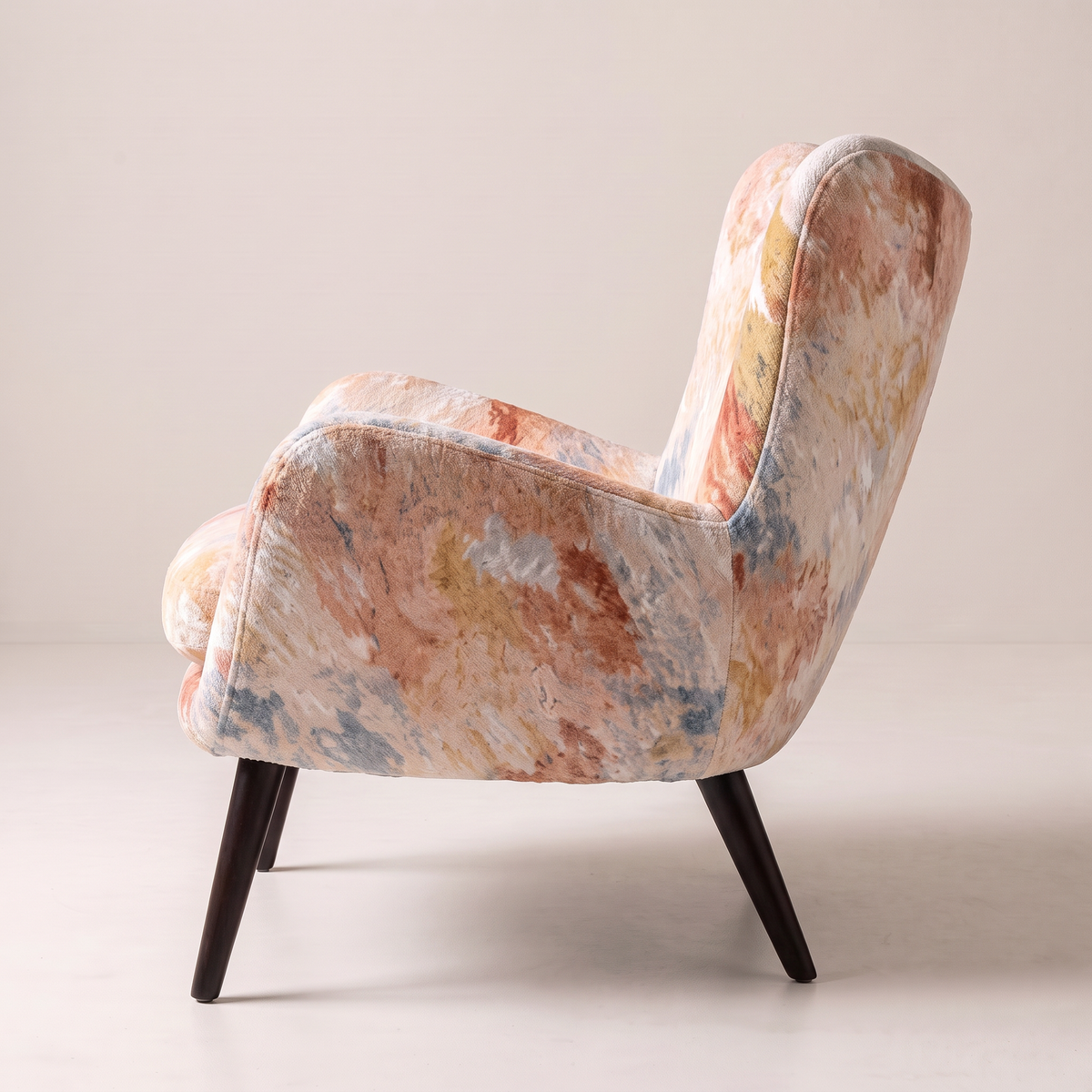 Canvas Fresco wingback lounge chair in painterly watercolour print, side profile view