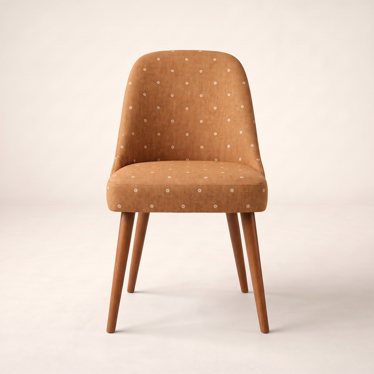 Chair 402 dining chair in caramel dotted upholstery with tapered wooden legs, front view