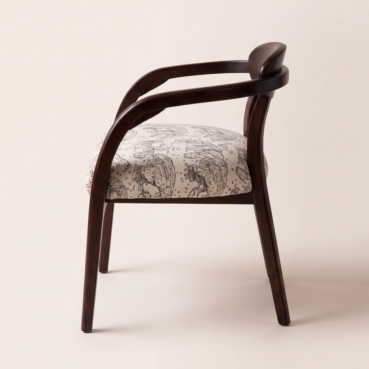 Chair 404 dining armchair in dark brown wood with curved arms and elephant-print seat, side profile