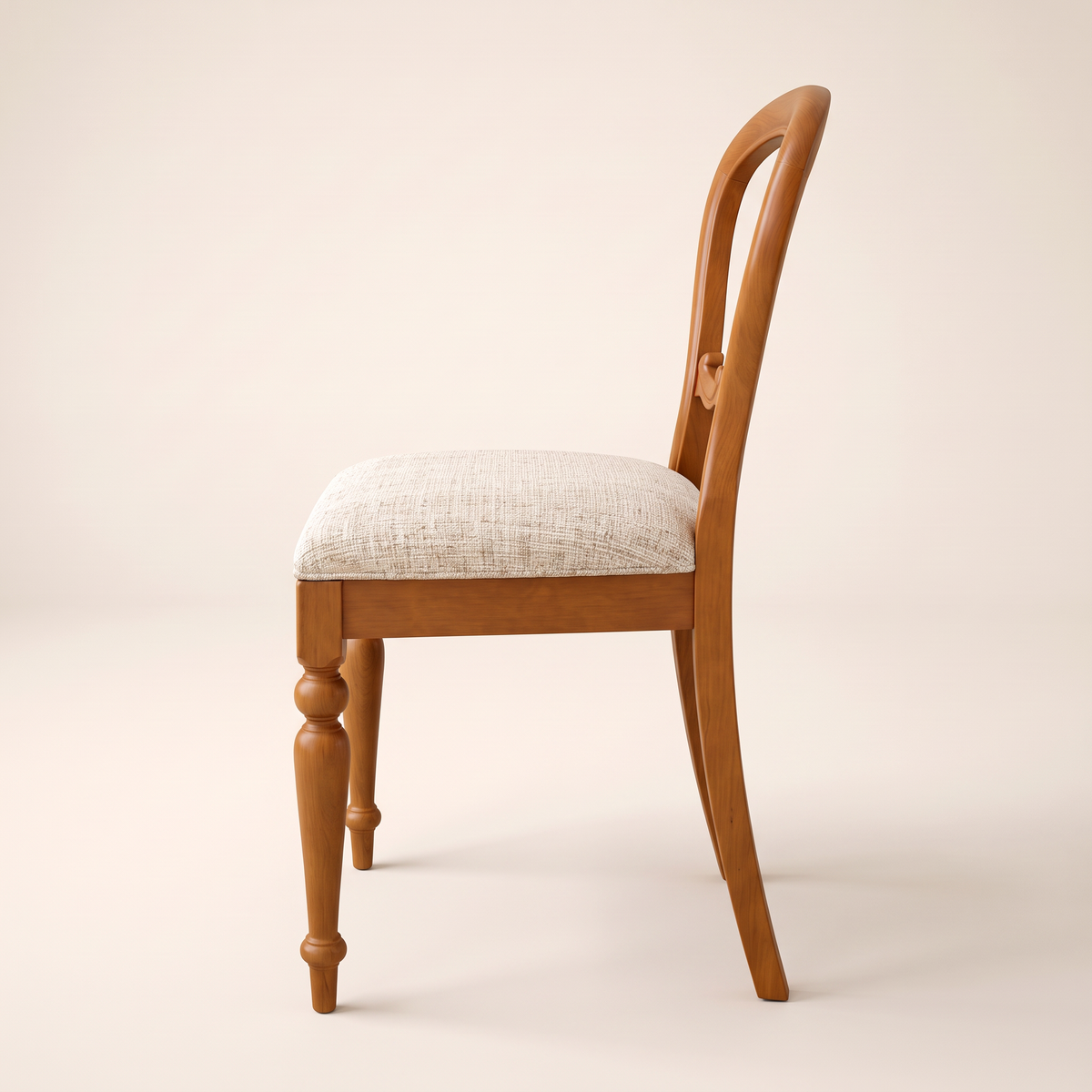 Chair 503 balloon-back dining chair in honey wood with turned legs and cream upholstered seat, side profile