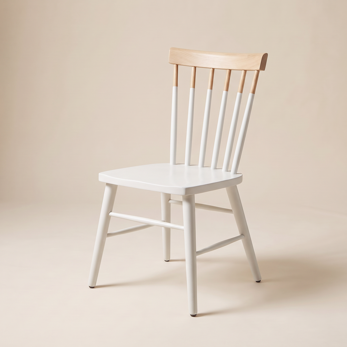 Chair 507 white spindle-back dining chair with natural wood crest rail, front-right three-quarter view