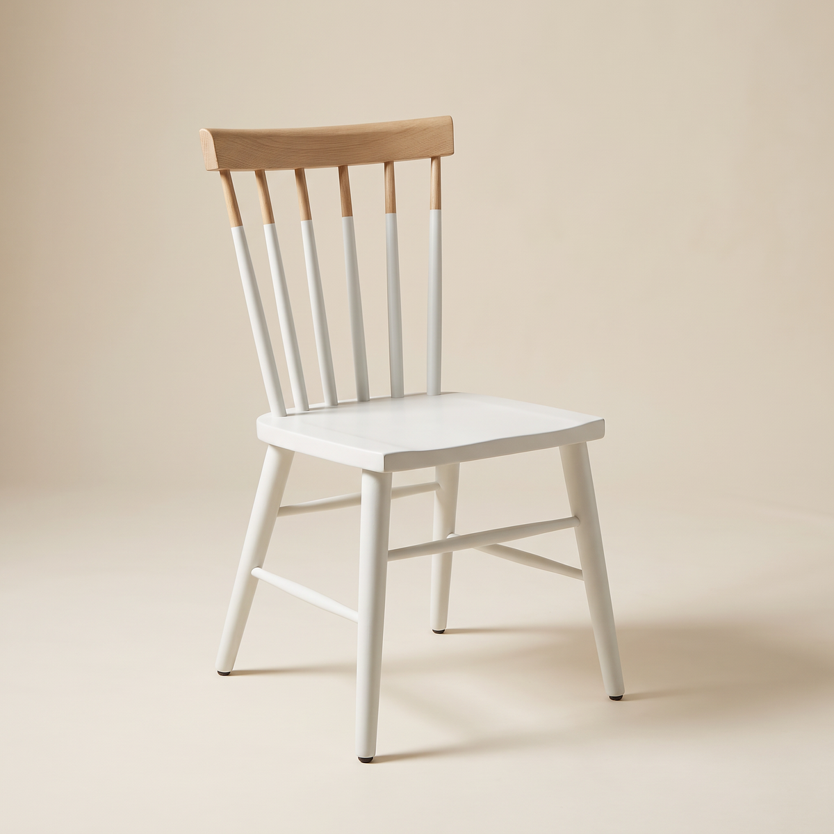 Chair 507 white spindle-back dining chair with natural wood crest rail, front three-quarter view