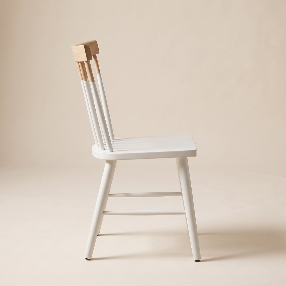 Chair 507 white spindle-back dining chair with natural wood crest rail, side profile