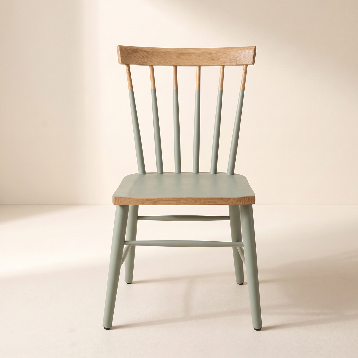 Chair 508 sage green spindle-back dining chair with natural wood crest rail, front view