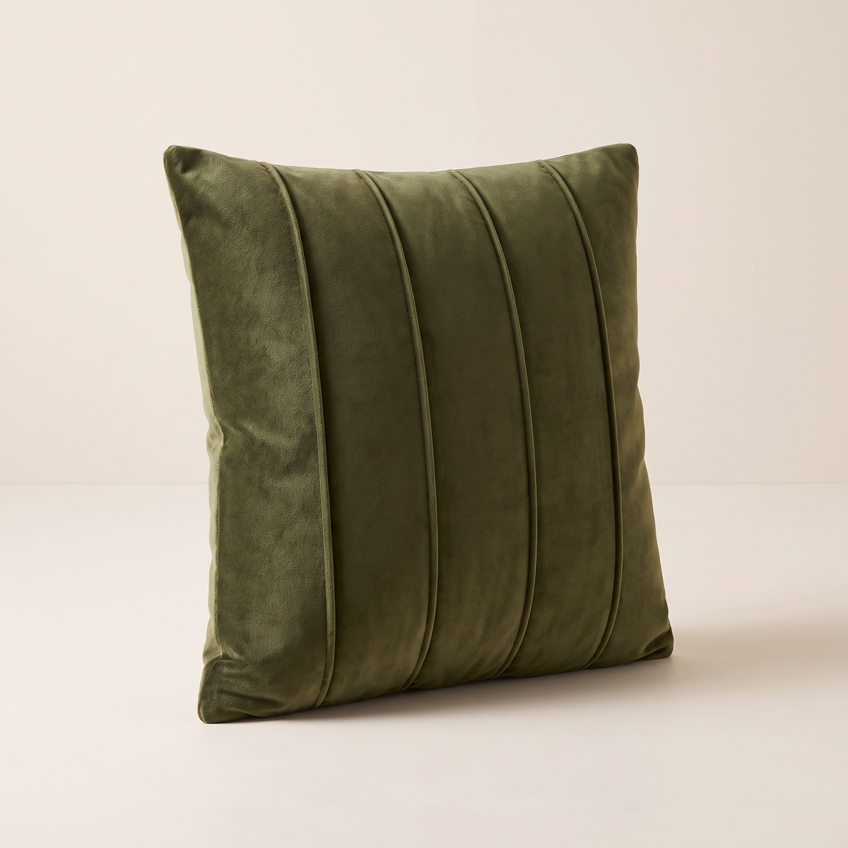 Channel Velvet Cushion in deep olive cotton velvet with five vertical channel-stitched ribs, front three-quarter view