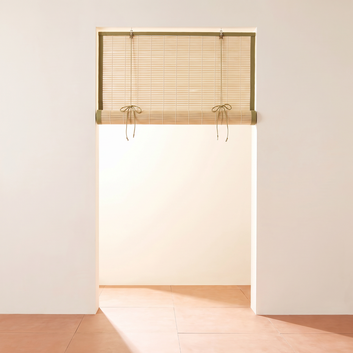 Chik Bamboo Blind rolled up high and tied with cotton cords
