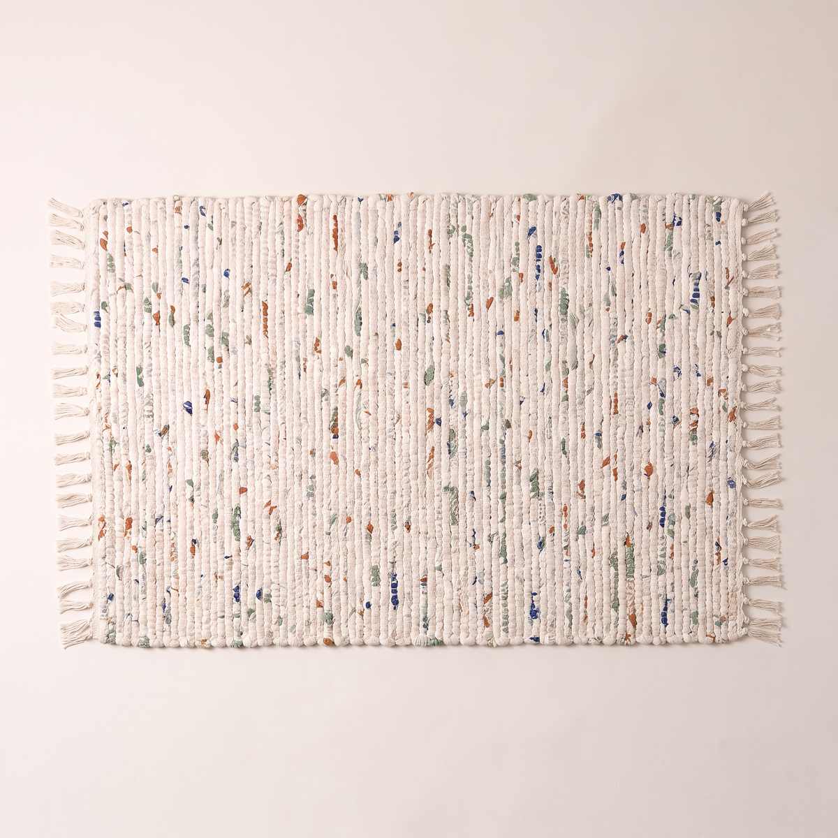 Chindi Rag Rug overhead flat lay showing the ivory rag weave with confetti flecks and fringed ends