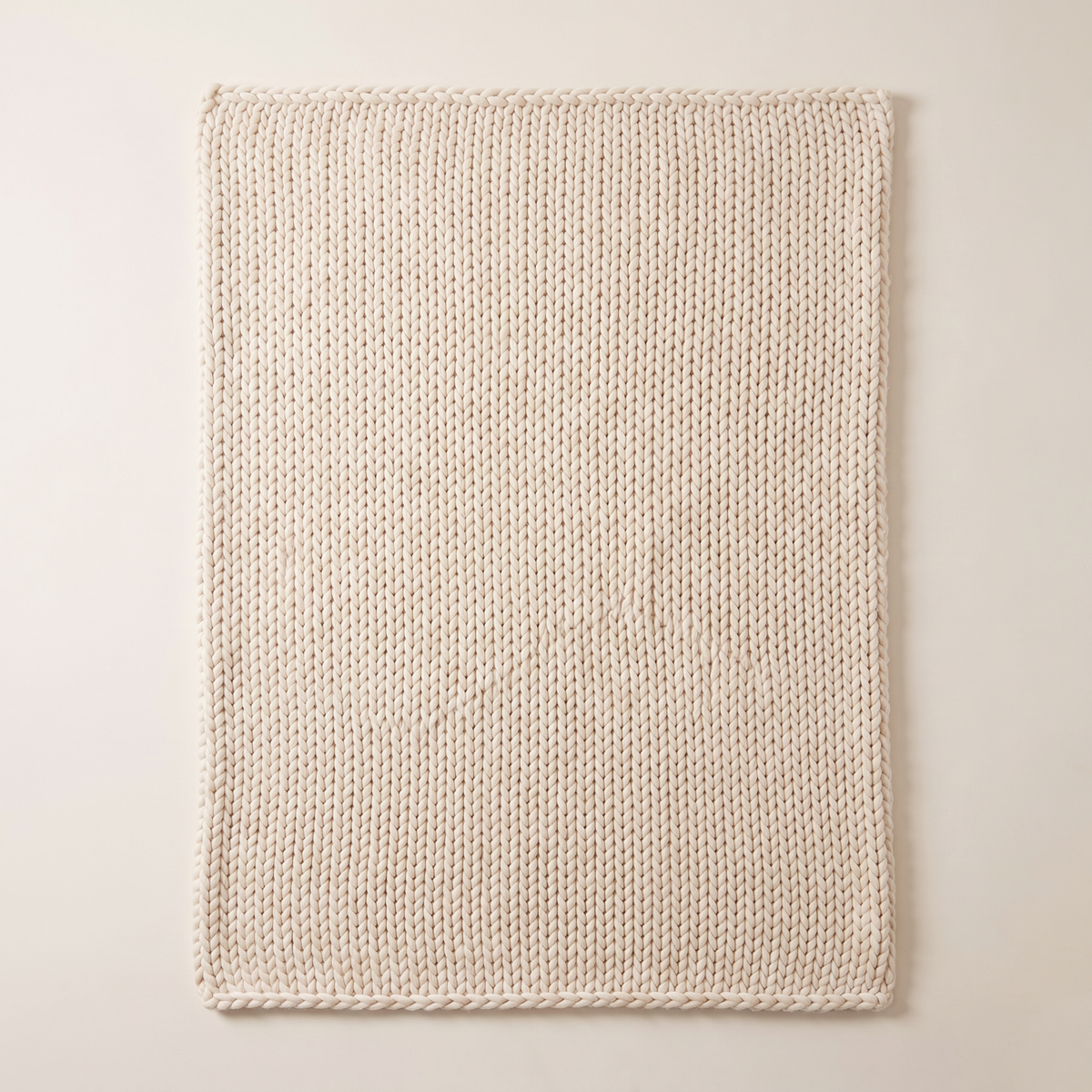 Chunky Knit Throw in ivory chunky knit, spread flat, overhead view of the whole throw