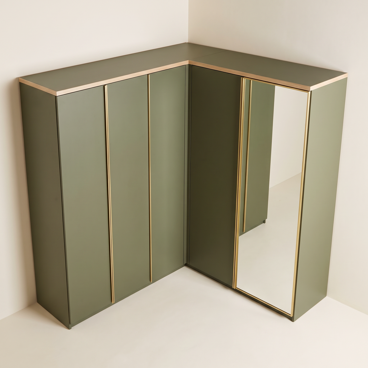 Corner Quay Wardrobe in olive with thin ash cornice, elevated view into the corner