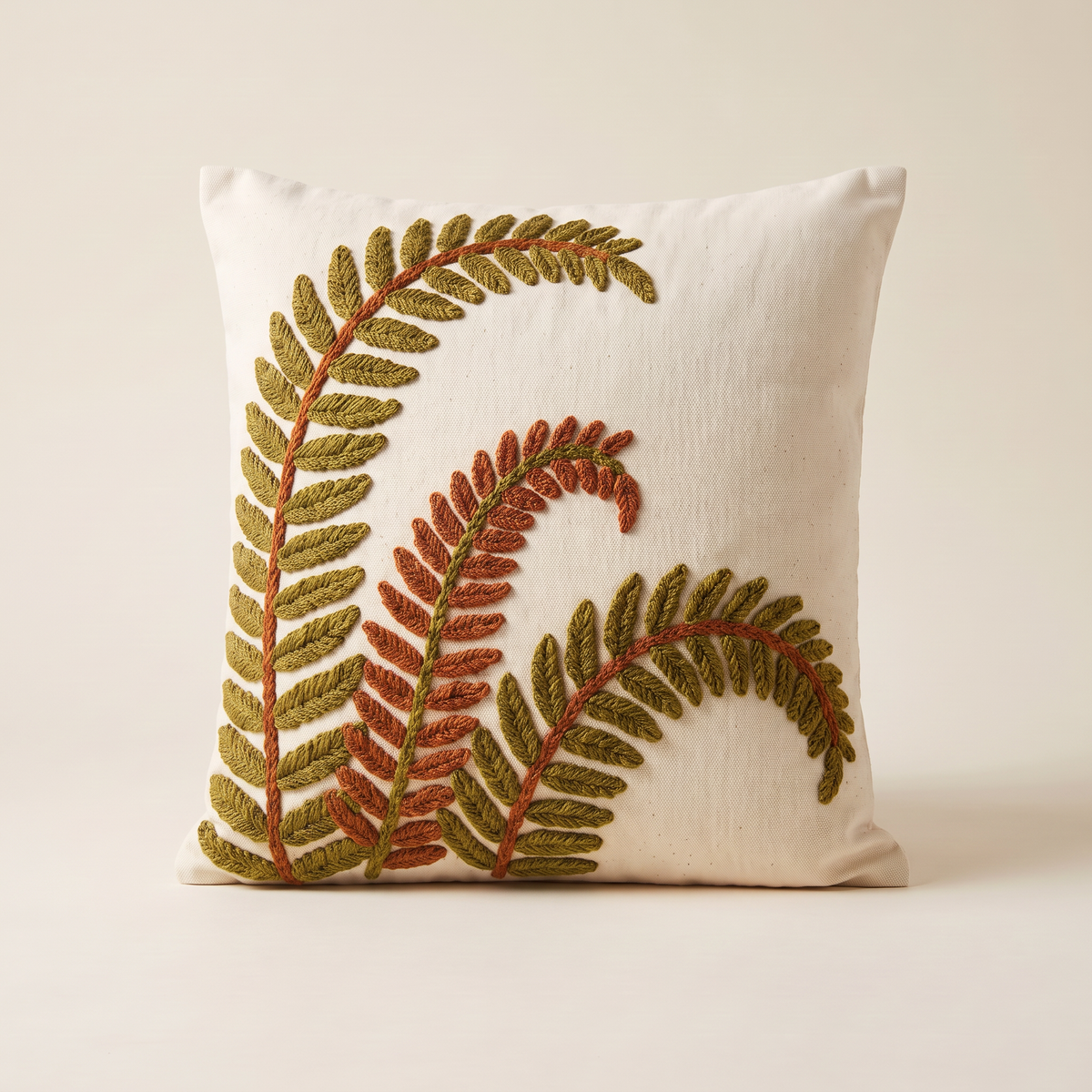 Crewel Fern Cushion with three embroidered fern fronds, straight front view