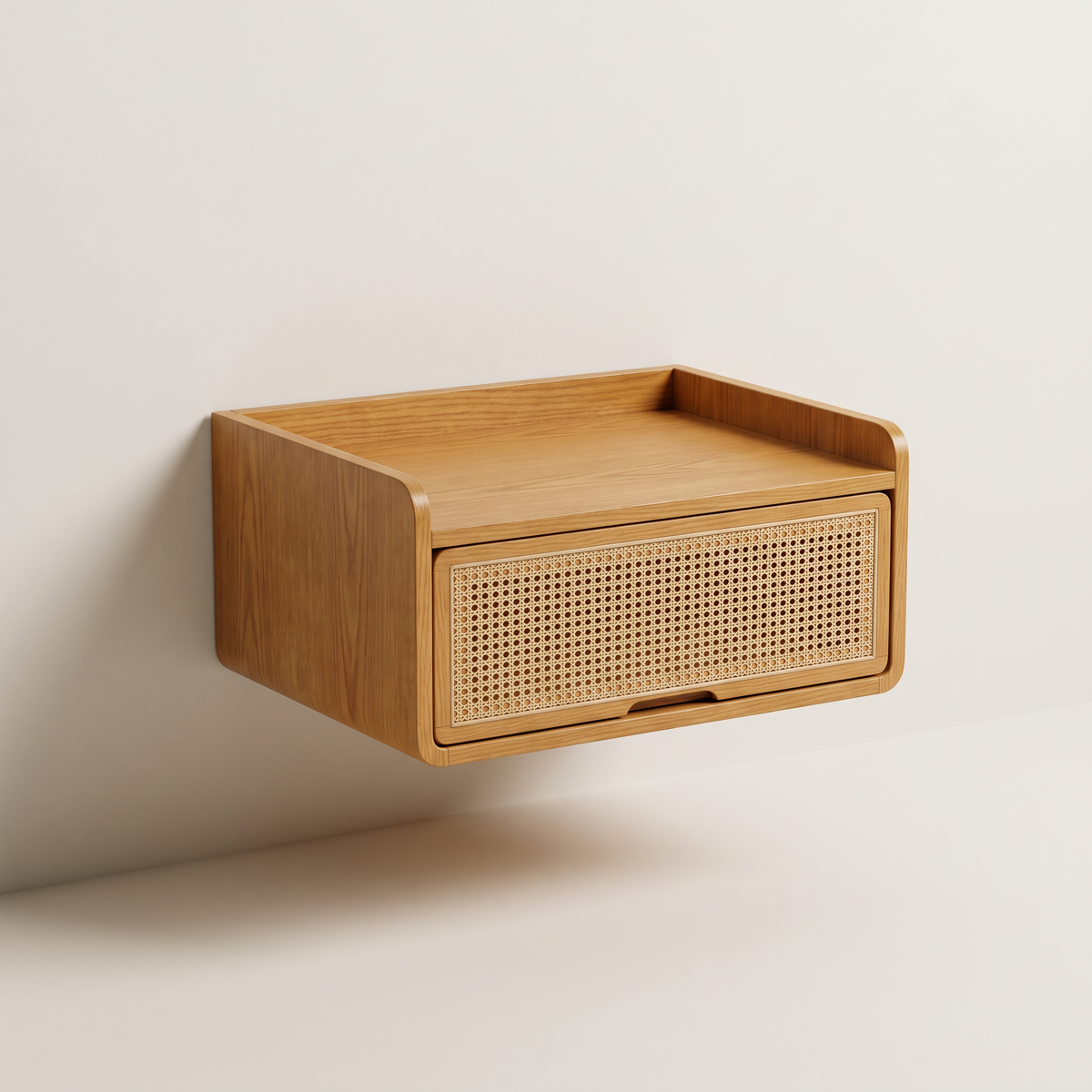 Drift Wall Bedside floating bedside table in honey ash veneer with cane drawer front and open top tray, front three-quarter view