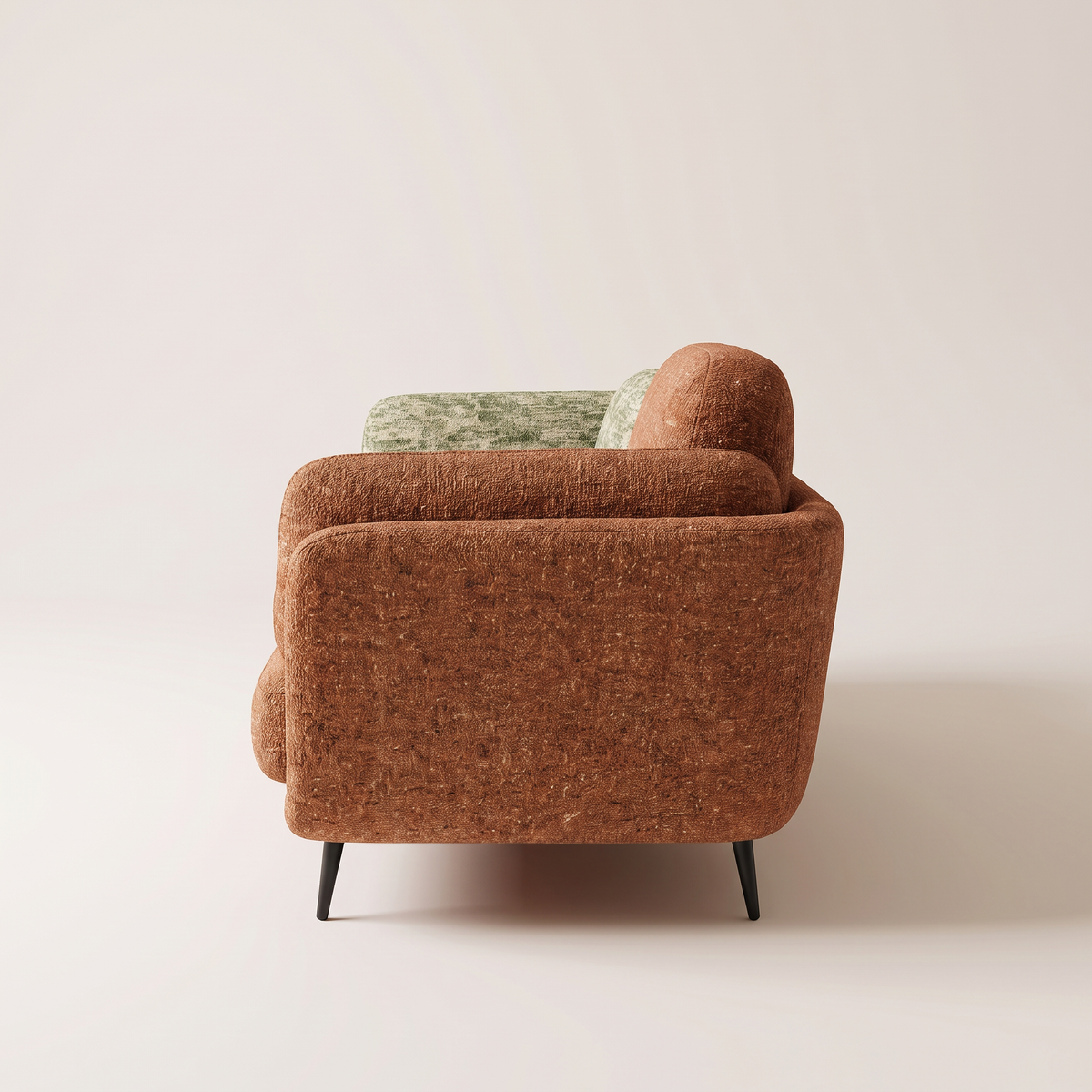 Duet Tera sofa in rust terracotta textured upholstery, side profile view