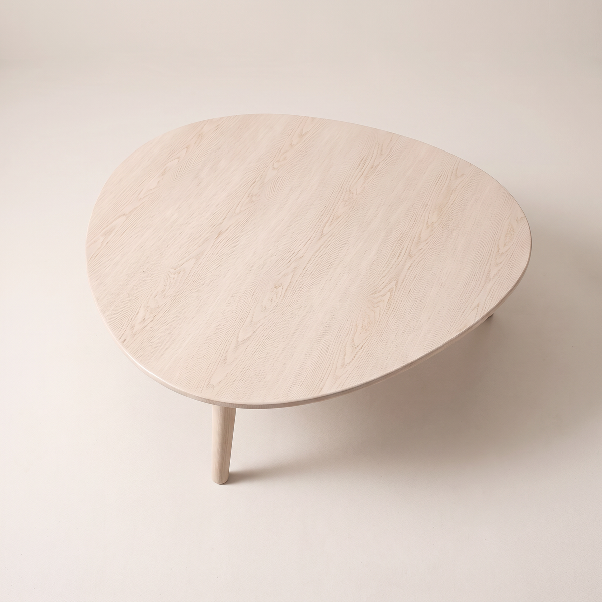 Eira Ash coffee table pebble-shaped pale ash wood top, elevated top view