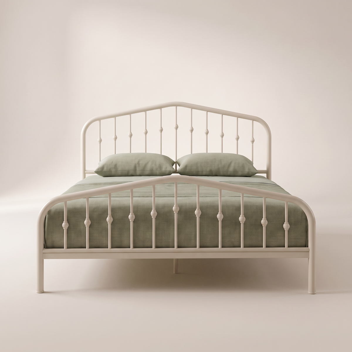 Elara bed in off-white powder-coated steel with beaded spindle headboard and footboard, view from the foot