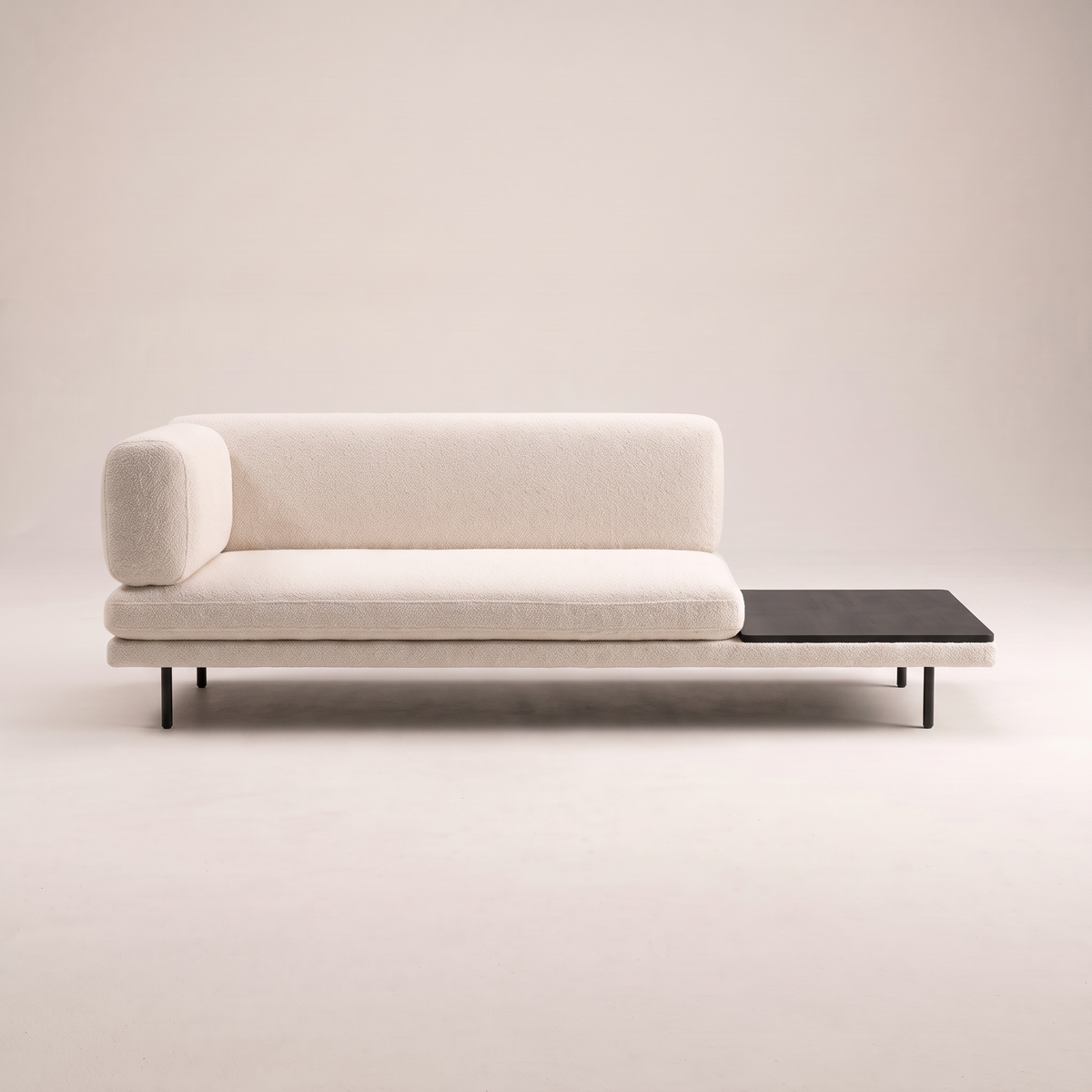 Eon Ivory low sofa in ivory boucle-style upholstery with dark table panel, front view