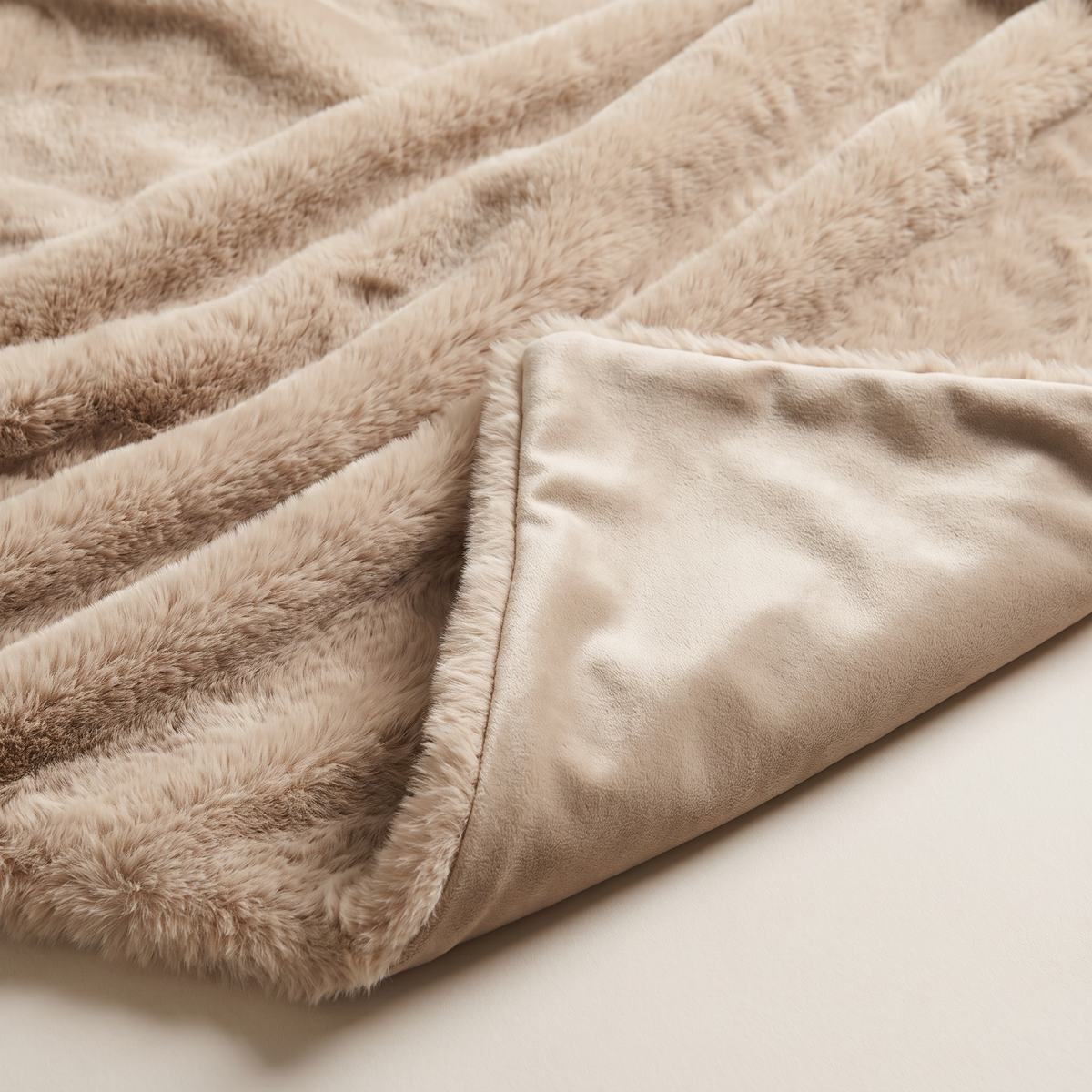 Faux Fur Throw close-up of the silky oat fur pile and smooth velvet back