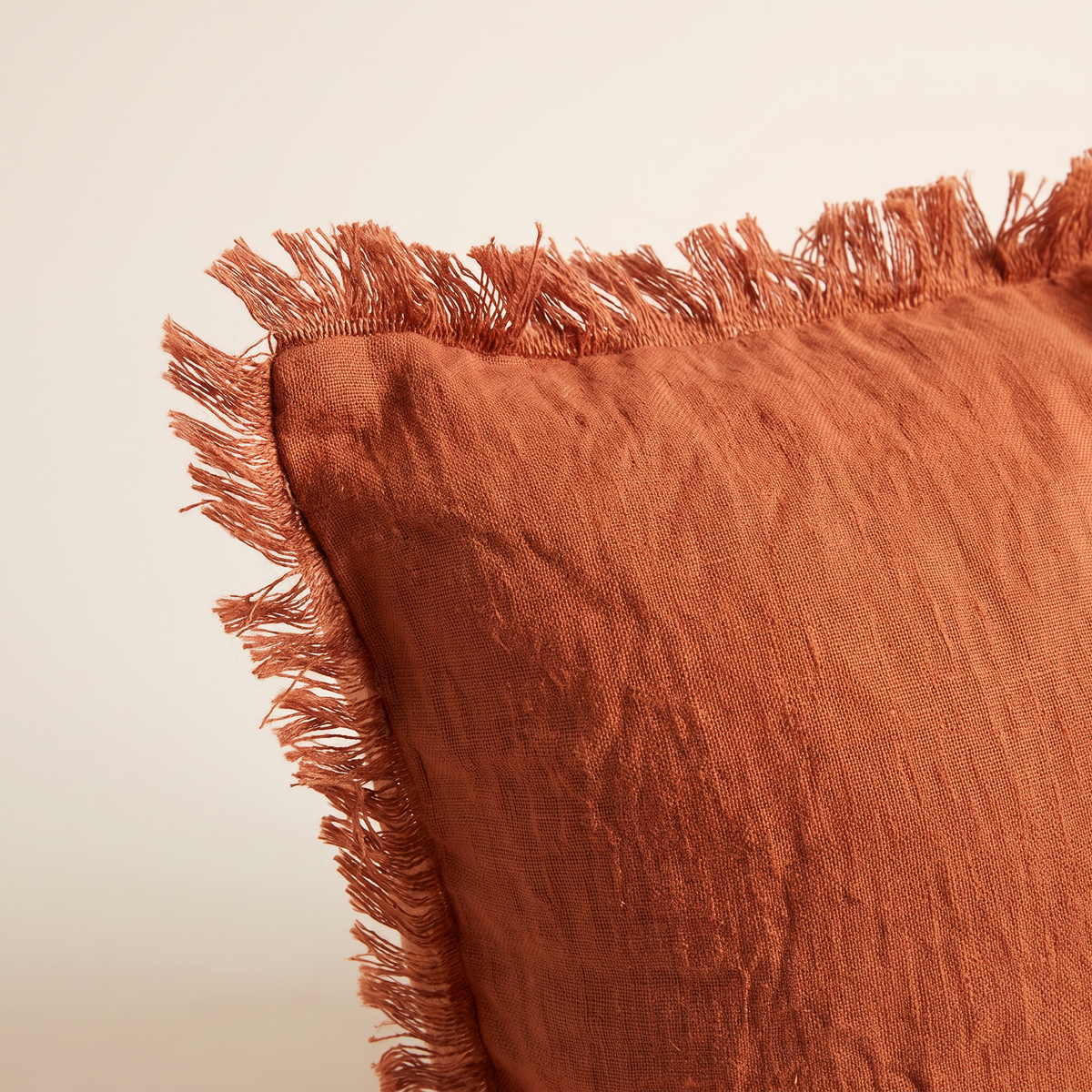 Close-up of Fringe Linen Cushion corner showing washed linen weave and frayed fringe