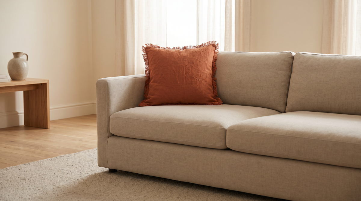 Fringe Linen Cushion styled on a sand sofa in a calm living room