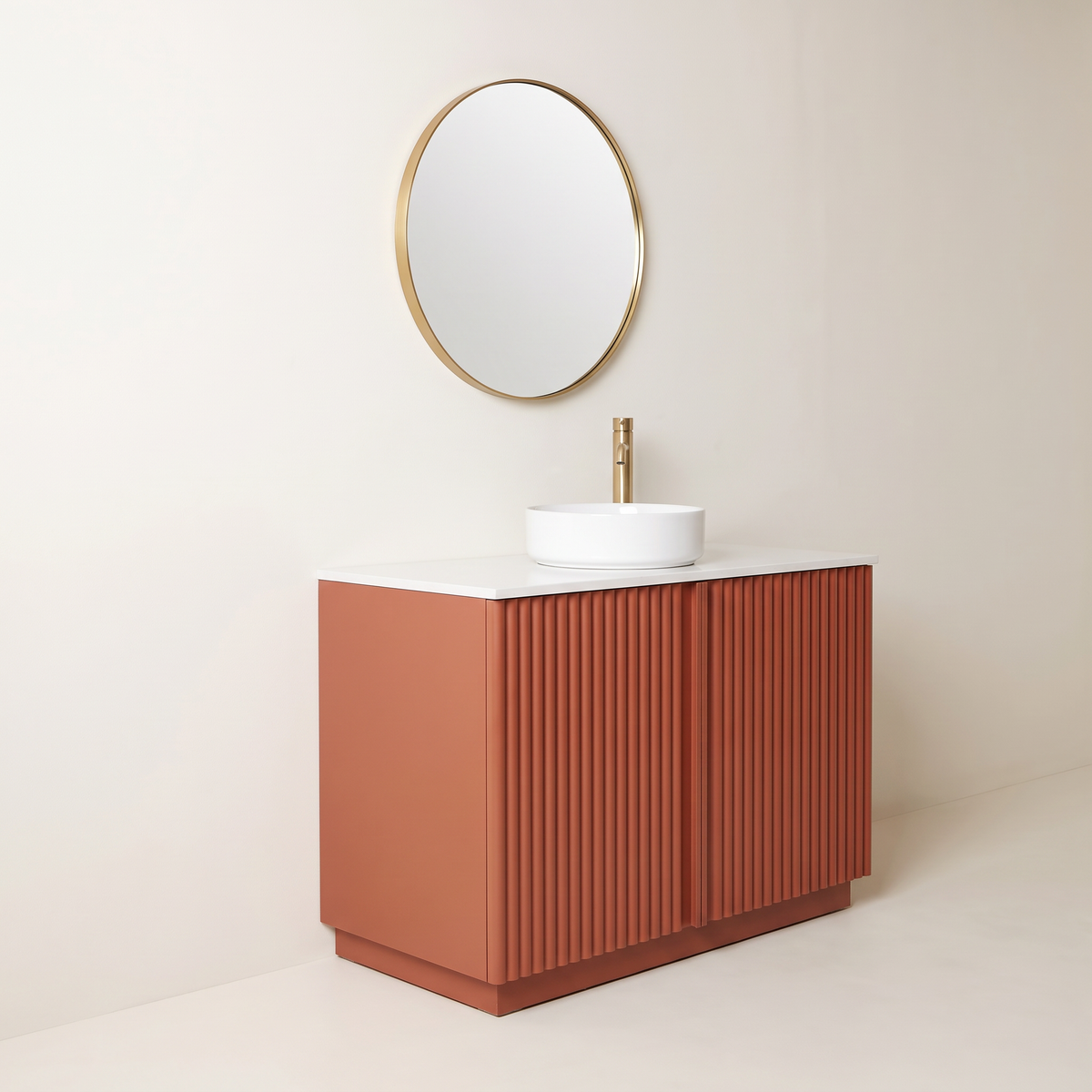 Furrow Rust Vanity with fluted rust doors and round brass mirror, front-left three-quarter view