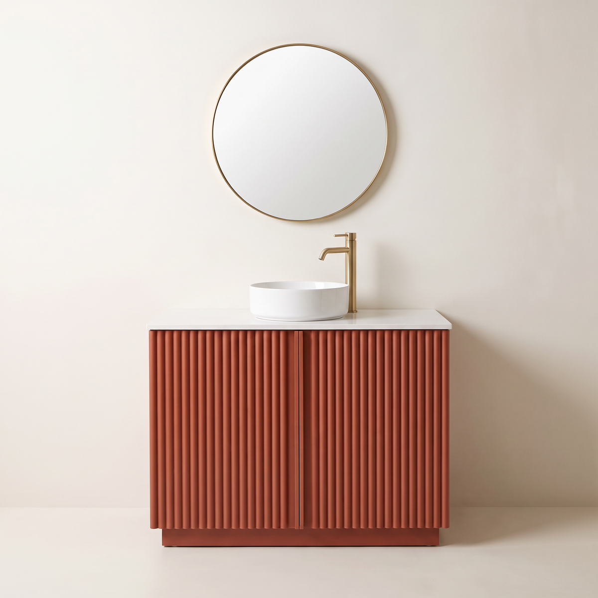 Furrow Rust Vanity in fluted matte rust lacquer with quartz top, vessel basin and round brass mirror, straight front view