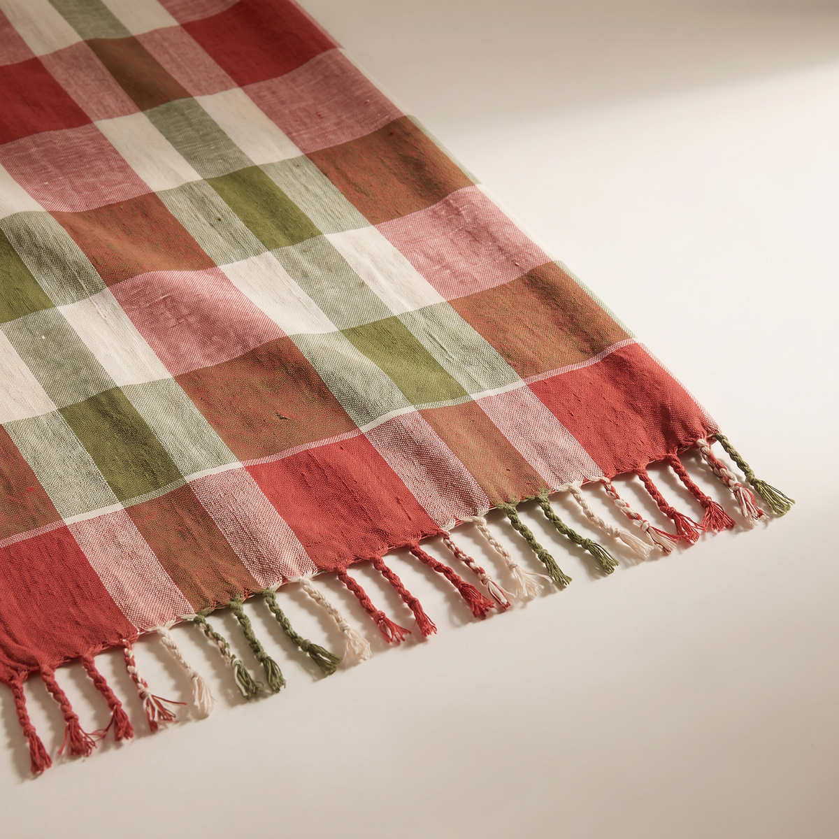 Gamcha Check Throw close-up of the handloom cotton check weave and short fringe