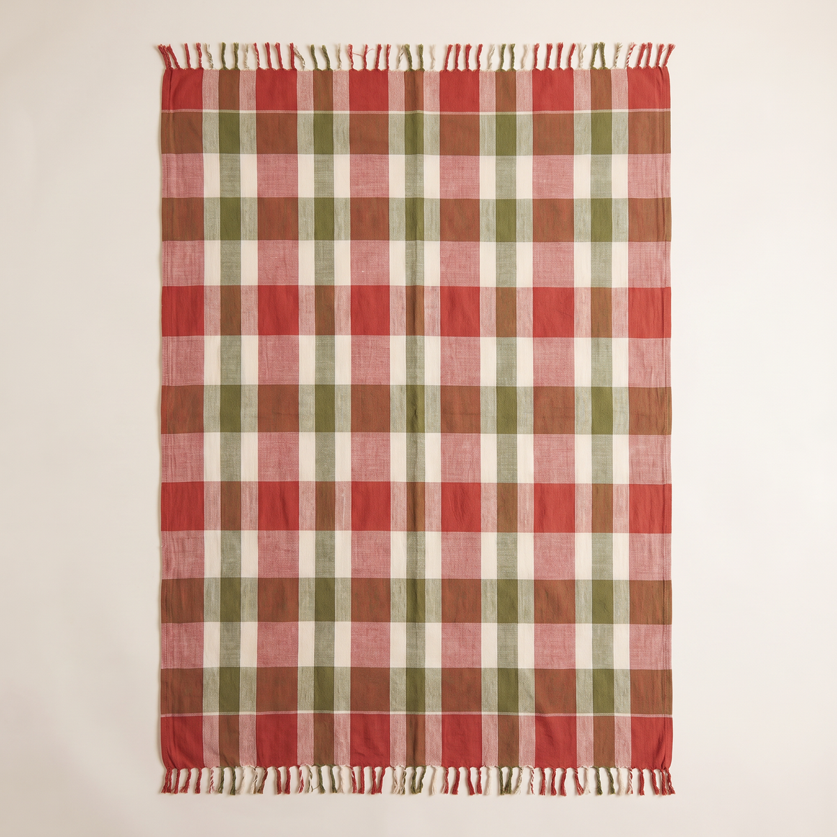 Gamcha Check Throw spread flat, overhead view of the red, ivory and olive check and fringed ends