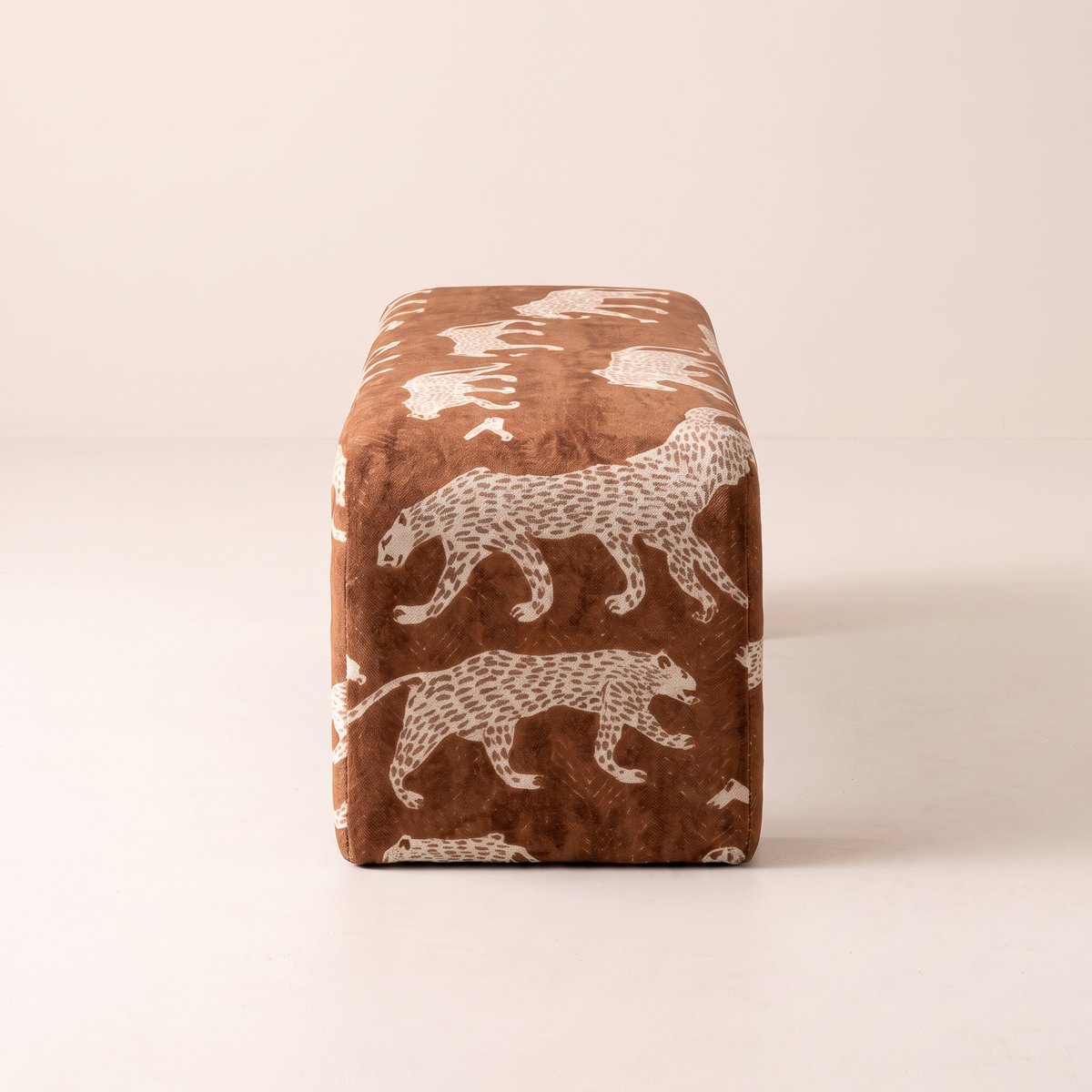Glyph – Nomad bench, end view showing the rounded slab end and leopard print