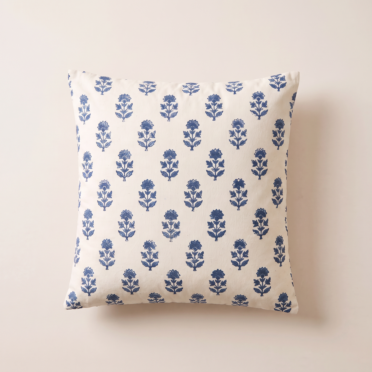 Indigo Buti Cushion lying flat, overhead view of the half-drop indigo sprig print